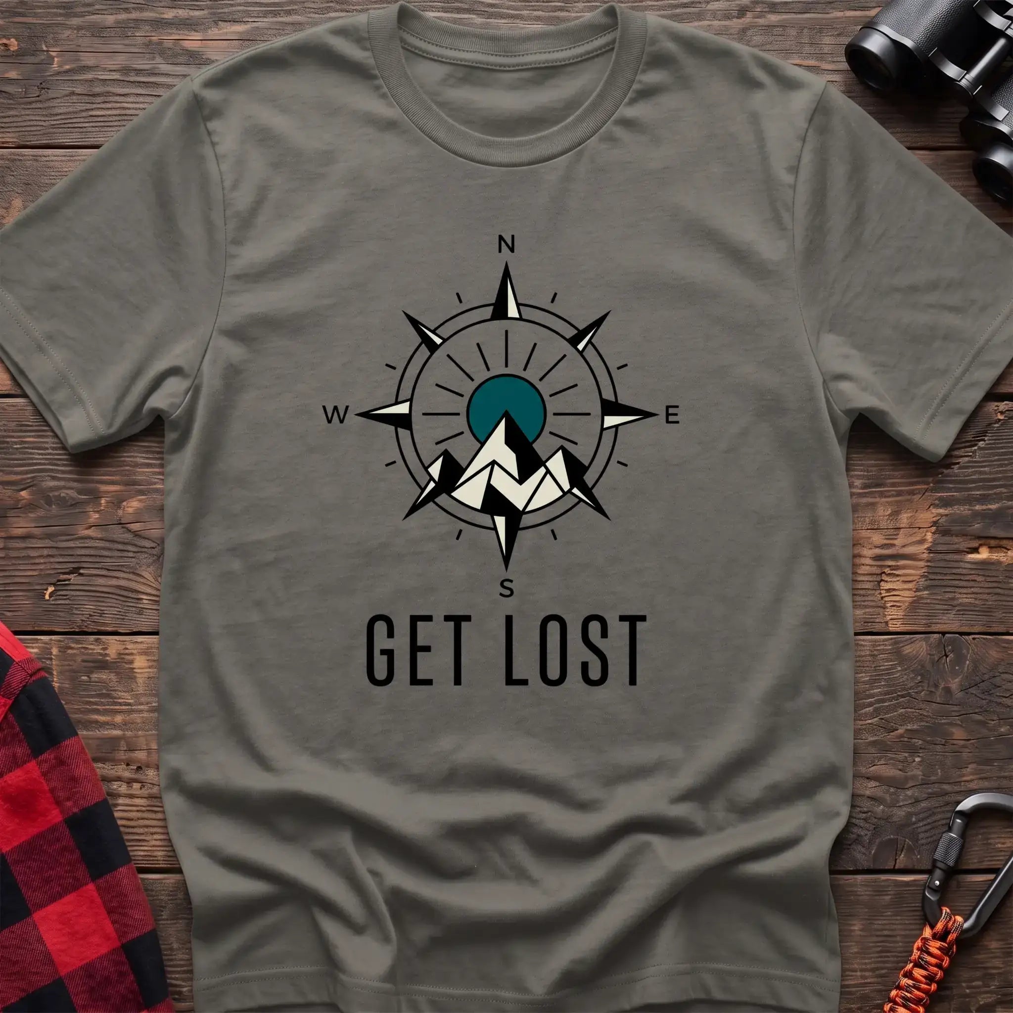 Heather military green t-shirt with compass rose graphic featuring mountains in the center and the text Get Lost
