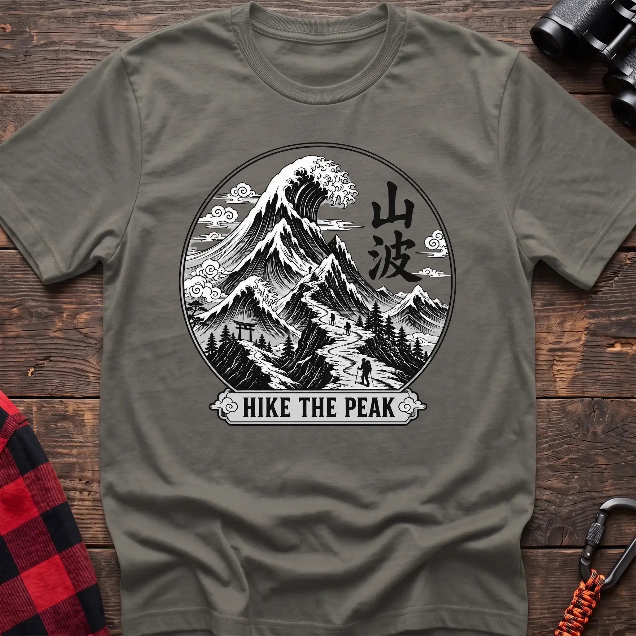 Heather military green t-shirt with circular Japanese-style mountain and wave graphic featuring hikers and the text Hike the Peak