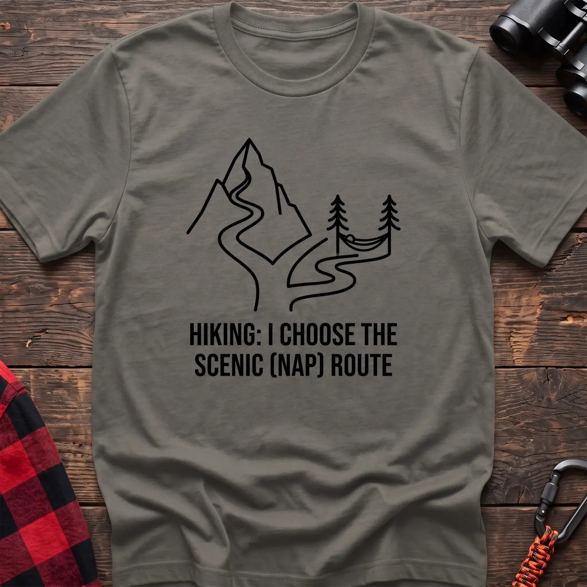 Heather military green t-shirt with minimalist mountain trail and hammock graphic reading Hiking I Choose the Scenic Nap Route