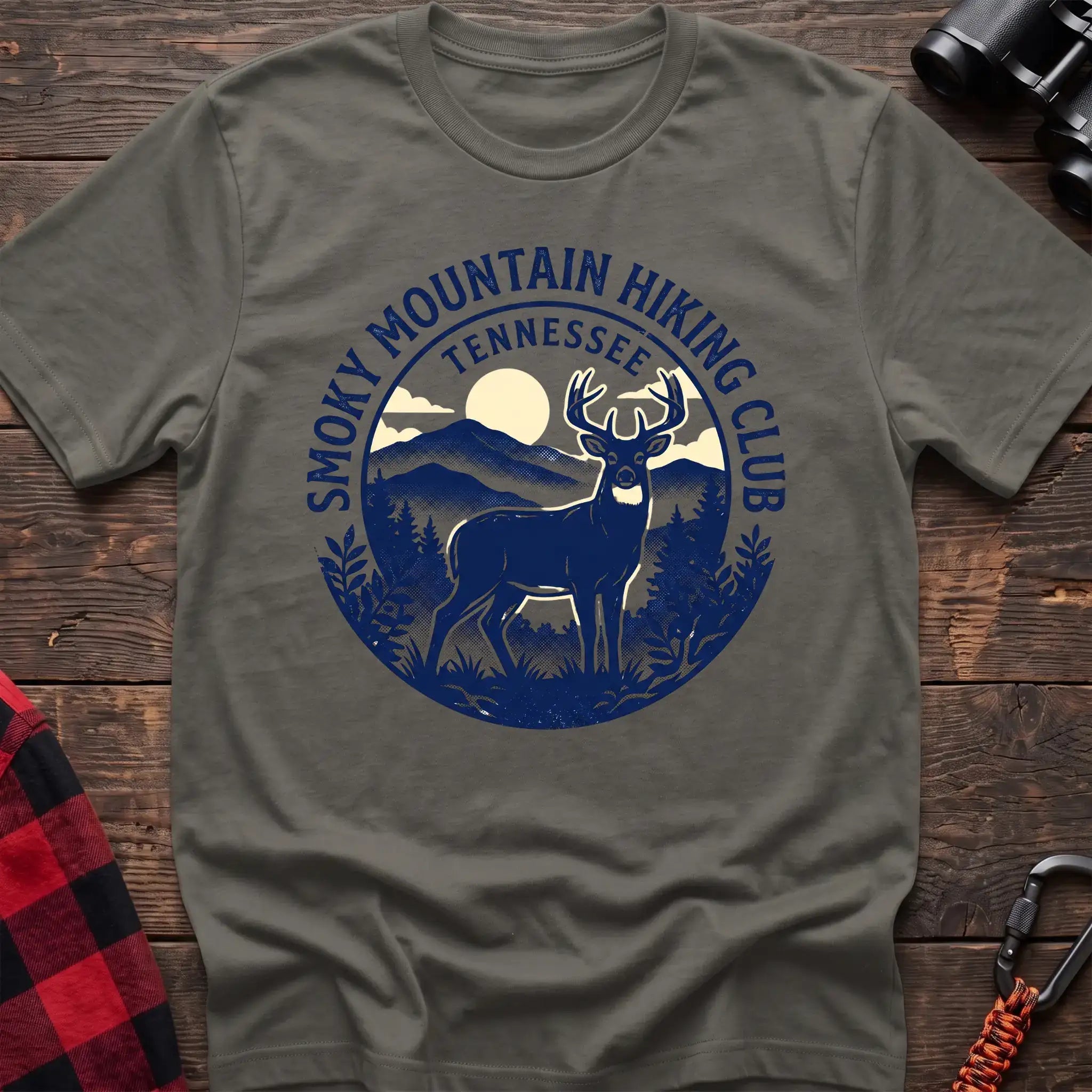 Heather military green t-shirt with circular badge graphic of a deer in the mountains reading Smoky Mountain Hiking Club Tennessee