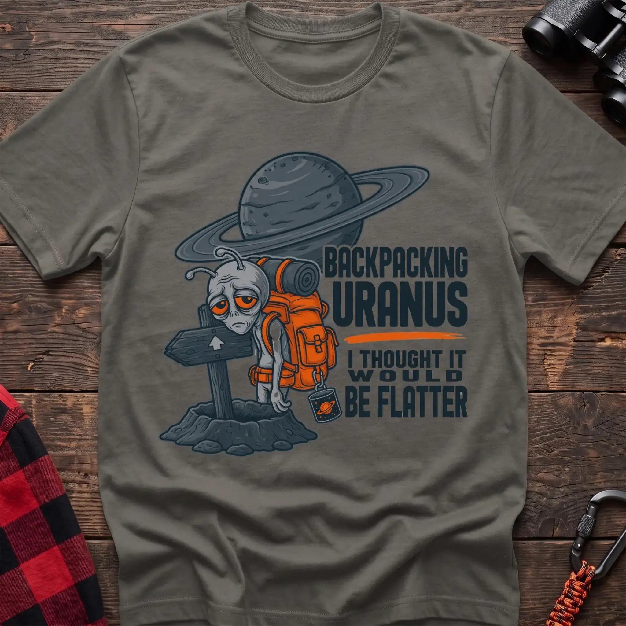 Heather military green t-shirt with tired alien backpacker next to a trail sign and the text Backpacking Uranus I Thought It Would Be Flatter