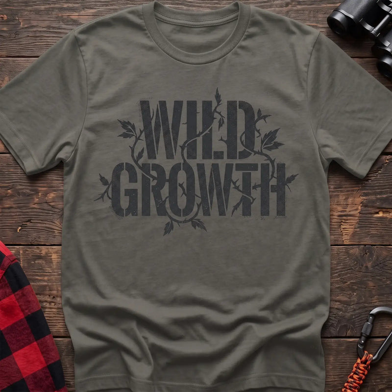 Heather military green t-shirt with dark text reading Wild Growth intertwined with thorny vines and leaves