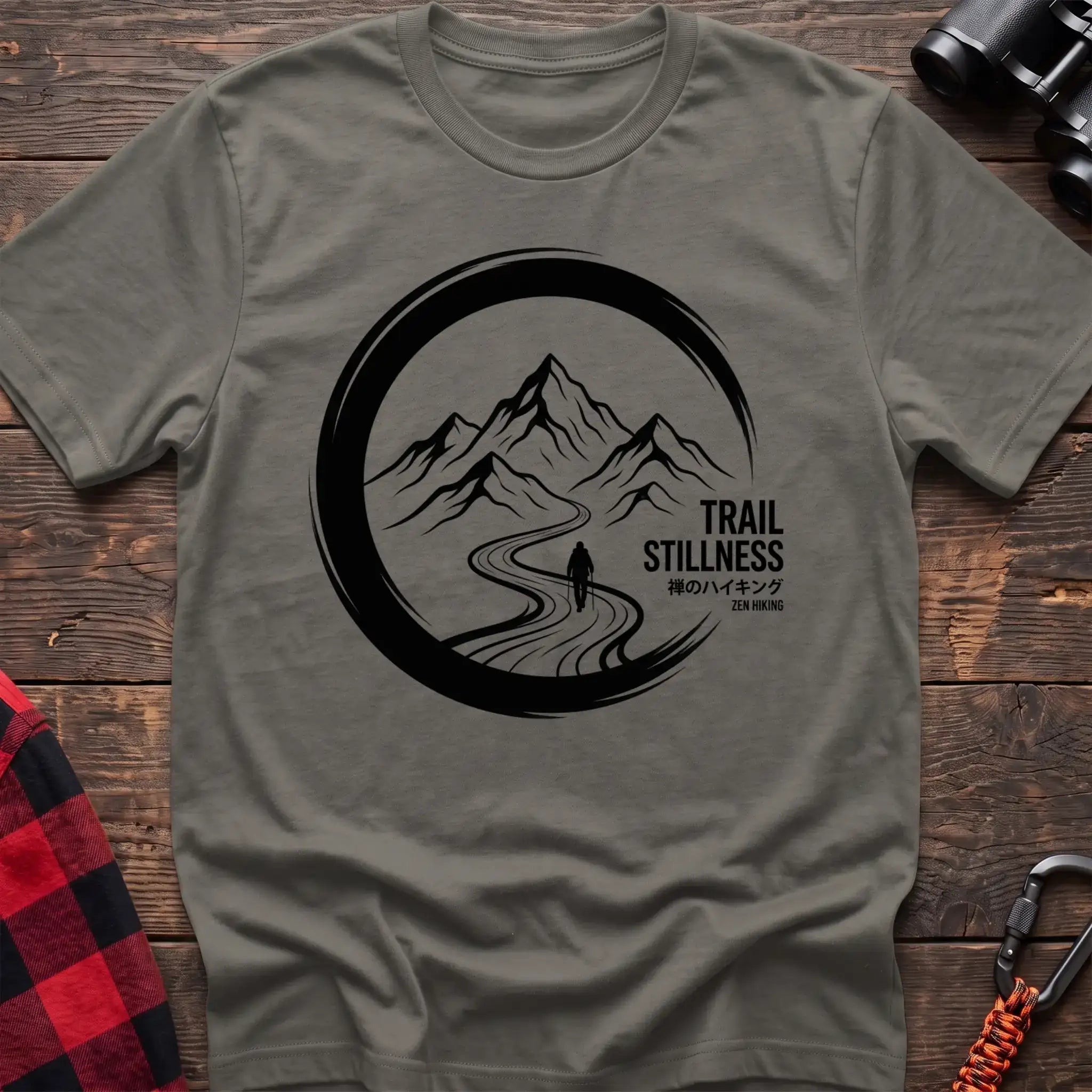 Heather military green t-shirt with circular mountain trail graphic of a hiker and the text Trail Stillness Zen Hiking