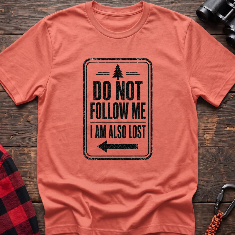 Heather orange hiking t-shirt with vintage trail sign reading Do Not Follow Me I Am Also Lost and a pine tree graphic