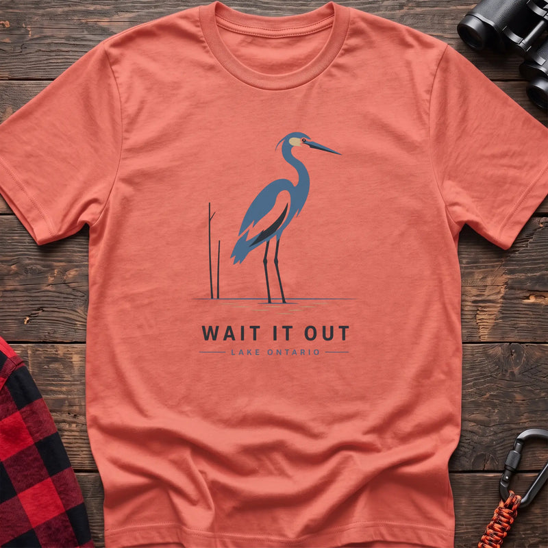 Heather orange hiking t-shirt with a blue heron graphic and the text “Wait It Out Lake Ontario”