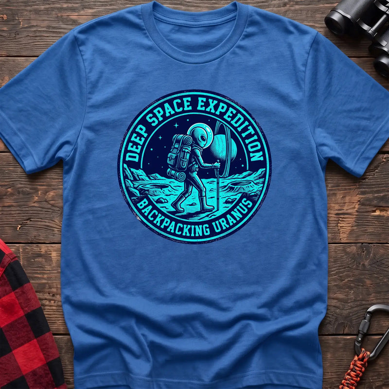 Heather royal t-shirt with circular badge graphic of an alien backpacking on Uranus, reading Deep Space Expedition Backpacking Uranus