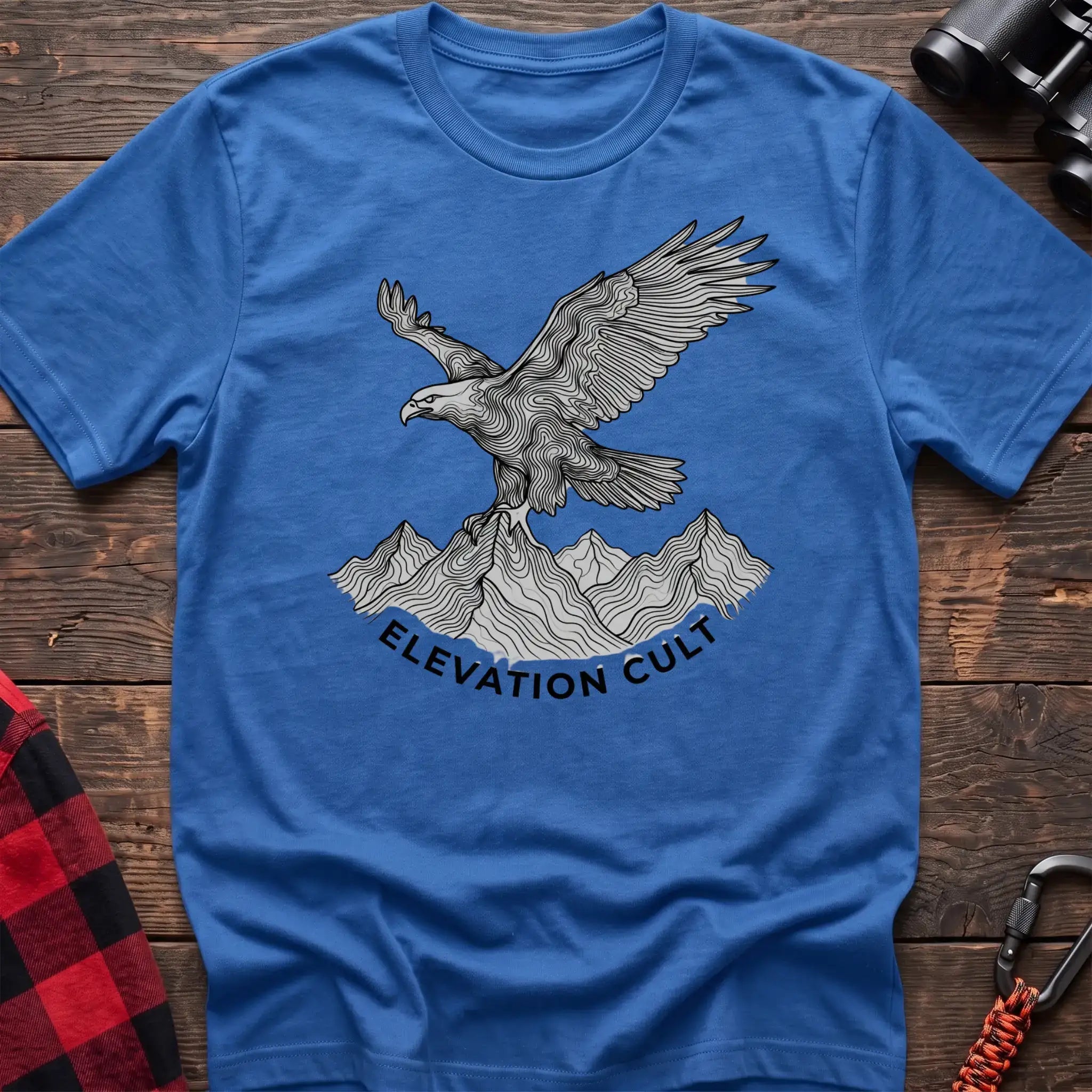 Heather royal t-shirt with detailed eagle perched on mountains graphic and the text Elevation Cult