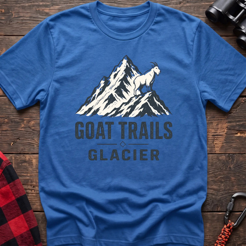 Heather royal cotton t-shirt with a mountain goat on a peak graphic and Goat Trails Glacier text on rustic wood