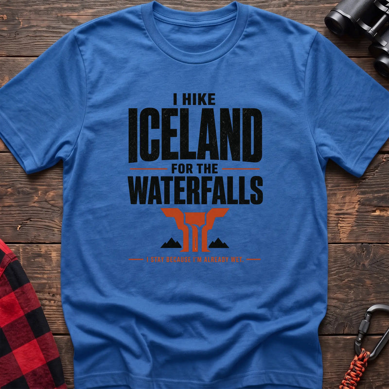 Heather royal cotton t-shirt with a waterfall graphic and I Hike Iceland for the Waterfalls text on rustic wood