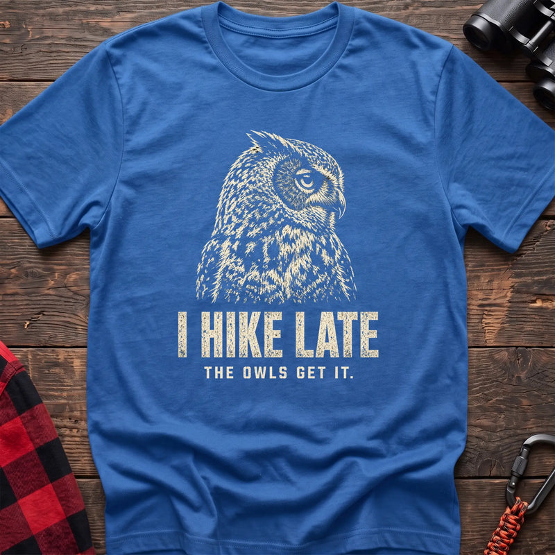Heather royal cotton t-shirt with an owl graphic and I Hike Late The Owls Get It text on rustic wood