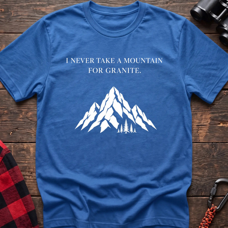 Heather royal cotton t-shirt with a mountain graphic and I Never Take a Mountain for Granite text on rustic wood