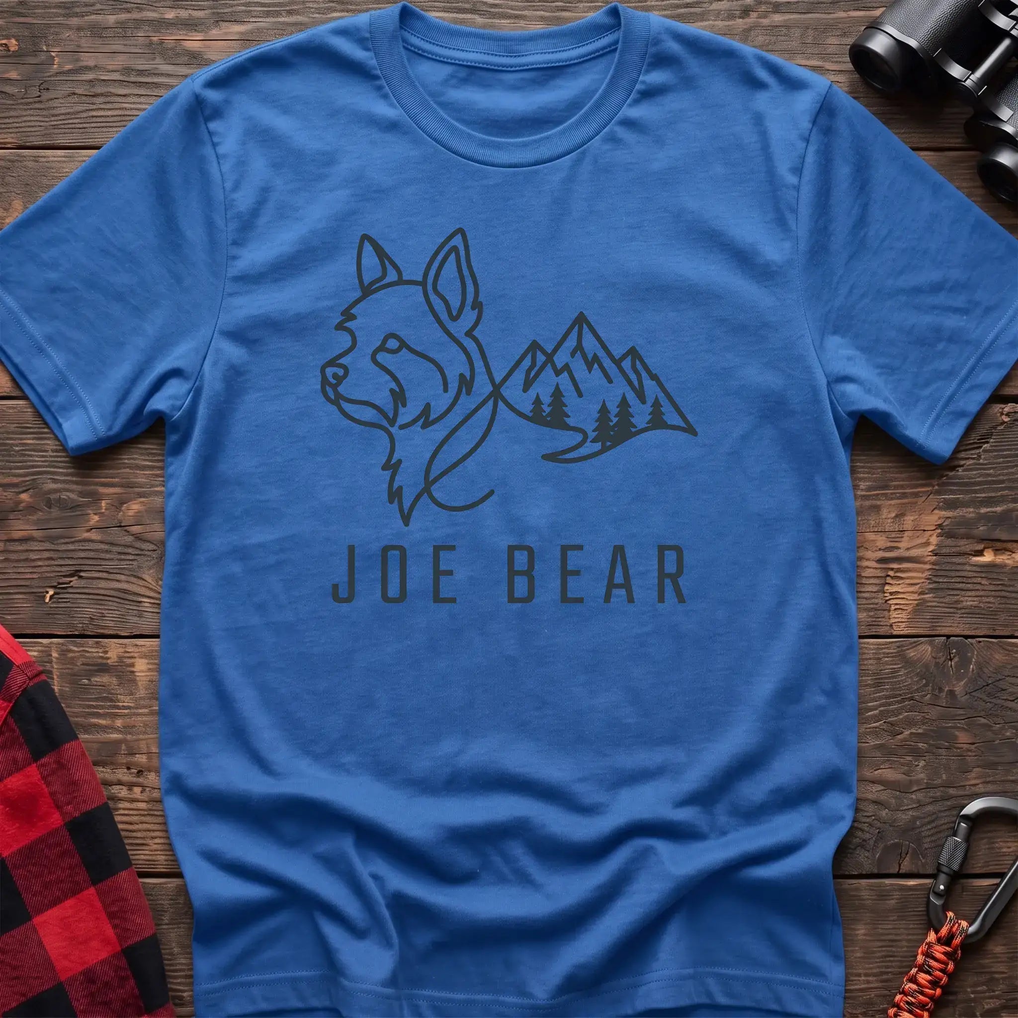Heather royal t-shirt with dark line art of a yorkie dog head blending into mountains and pine trees, with the text Joe Bear