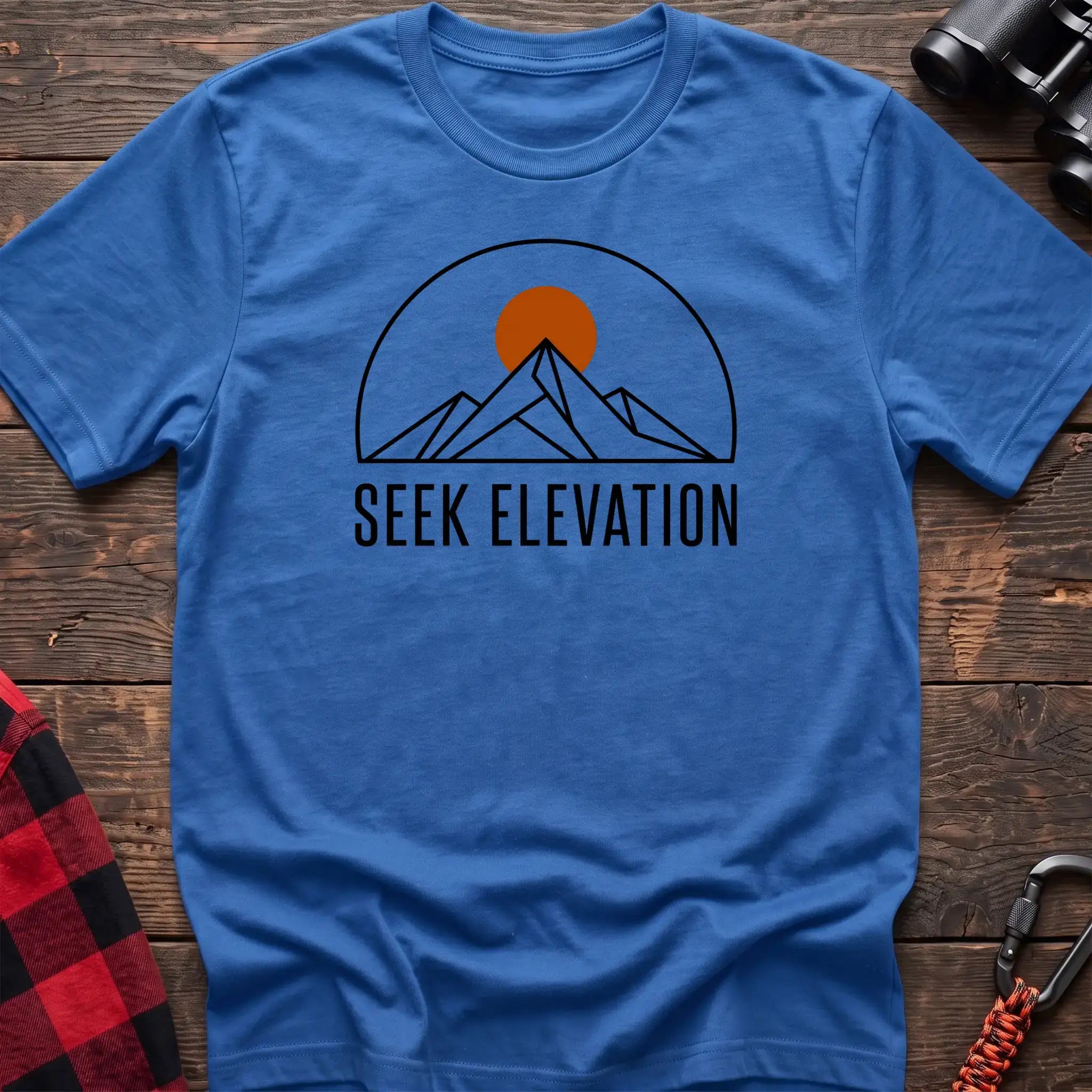 Heather royal t-shirt with minimalist mountain and sun graphic reading Seek Elevation