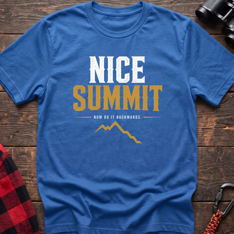 Heather royal cotton t-shirt with a mountain graphic and Nice Summit Now Do It Backwards text on rustic wood