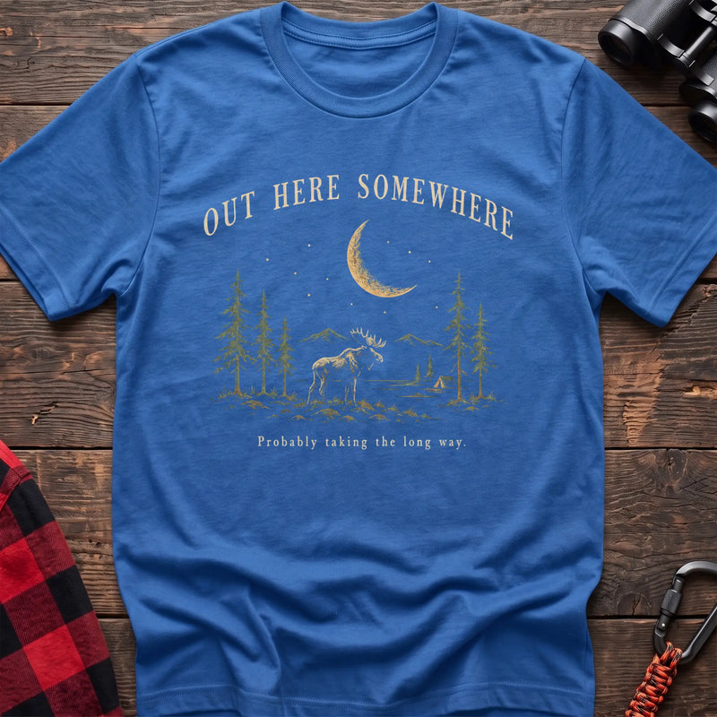 Heather royal cotton t-shirt with a moonlit moose and pines graphic and Out Here Somewhere text on rustic wood