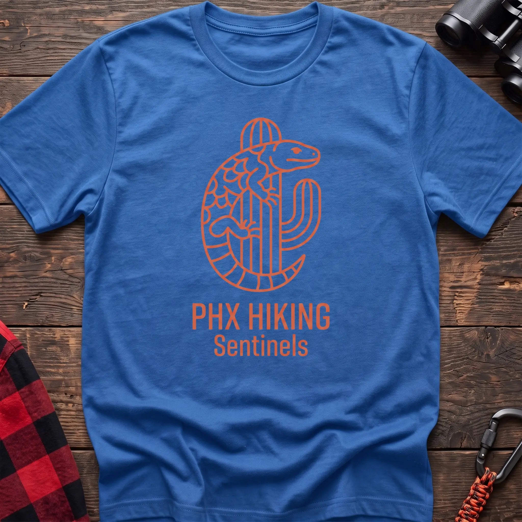 Heather royal t-shirt with orange line-art Gila monster wrapped around a saguaro cactus and the text “PHX HIKING Sentinels”