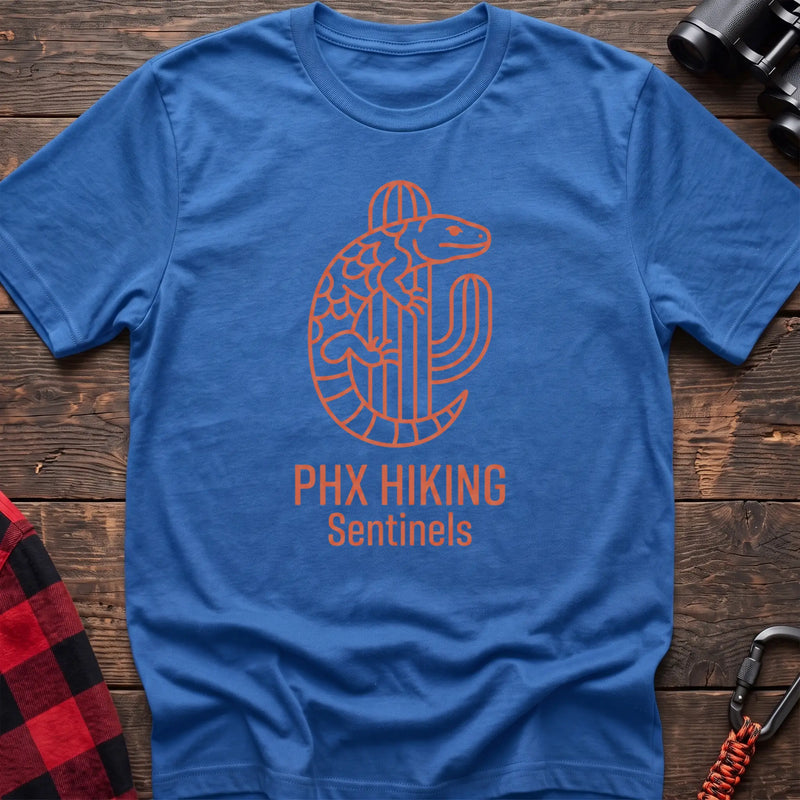 Heather royal t-shirt with orange line-art Gila monster wrapped around a saguaro cactus and the text “PHX HIKING Sentinels”