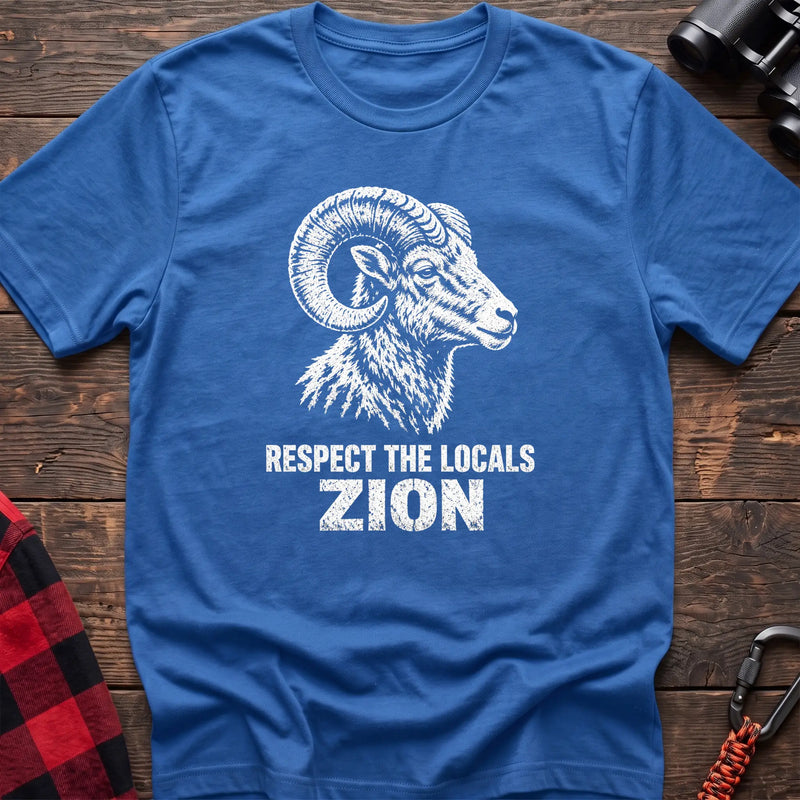 Heather royal cotton t-shirt with a bighorn ram graphic and Respect the Locals Zion text on rustic wood