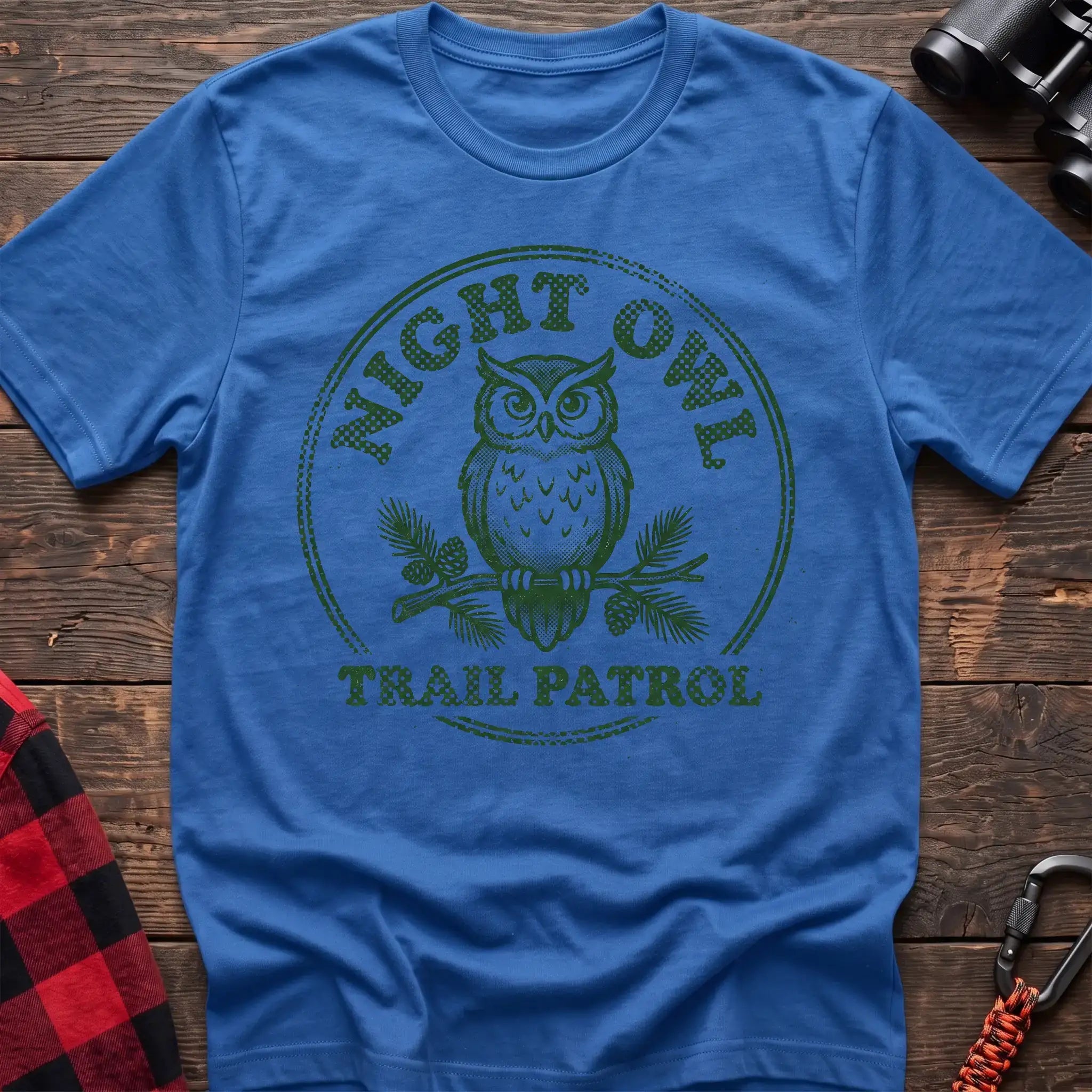 Heather royal t-shirt with green owl on a pine branch graphic and the text Night Owl Trail Patrol