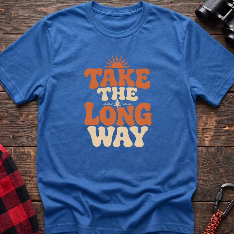 Heather royal cotton t-shirt with retro wavy text and Take the Long Way lettering on rustic wood