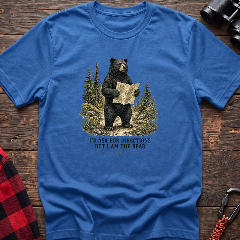 Heather royal cotton t-shirt with a bear holding a map graphic and I’d Ask for Directions But I Am the Bear text on rustic wood