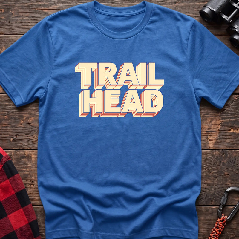 Black cotton t-shirt with retro stacked Trail Head text on rustic wood