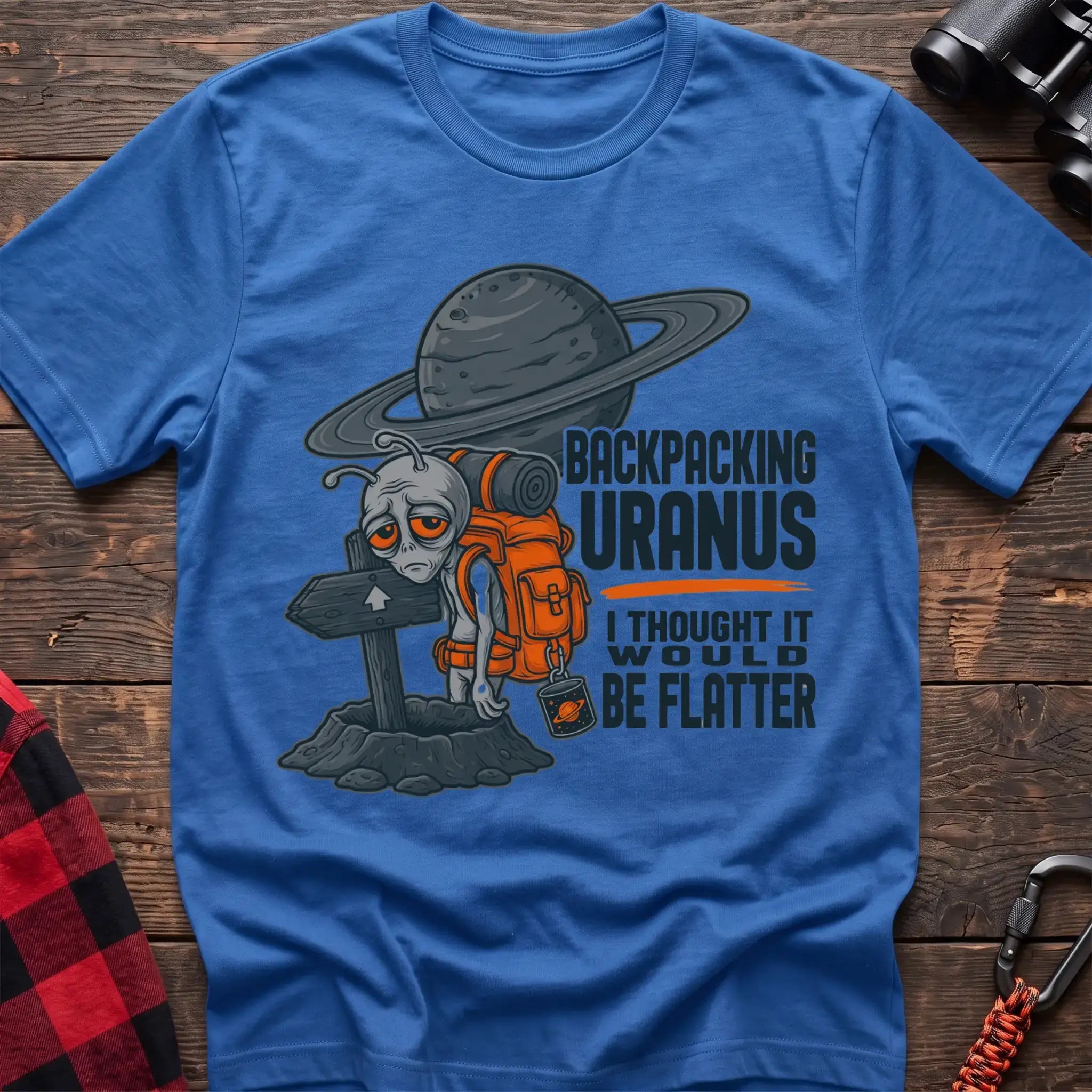 Heather royal t-shirt with tired alien backpacker next to a trail sign and the text Backpacking Uranus I Thought It Would Be Flatter