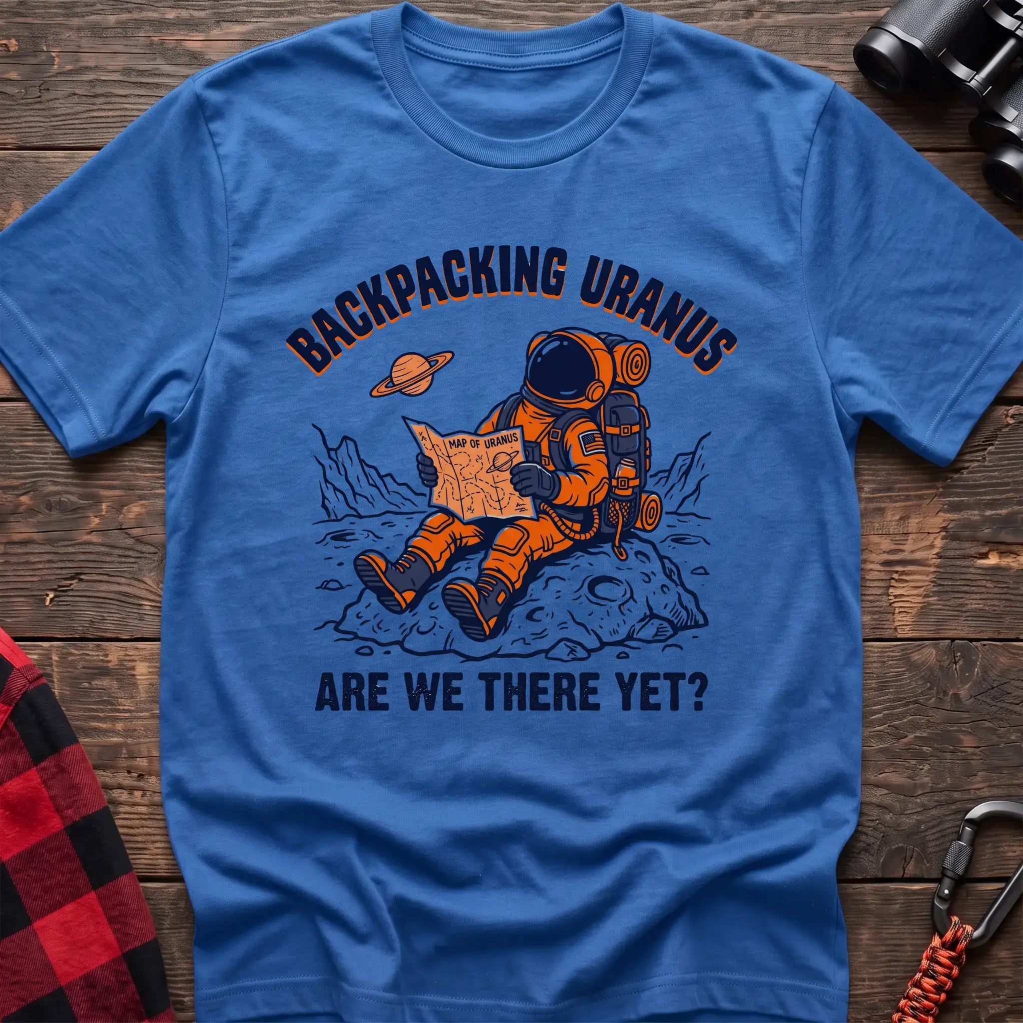 Heater royal t-shirt with astronaut sitting on a rock reading a Map of Uranus and the text Backpacking Uranus Are We There Yet
