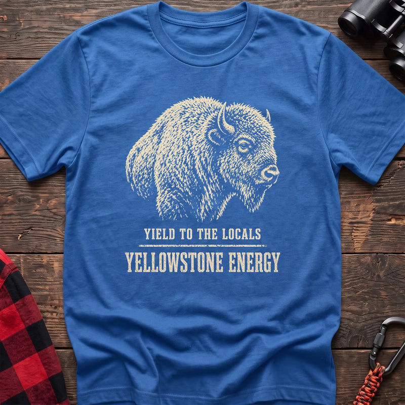 Heather royal cotton t-shirt with a bison graphic and Yield to the Locals Yellowstone Energy text on rustic wood