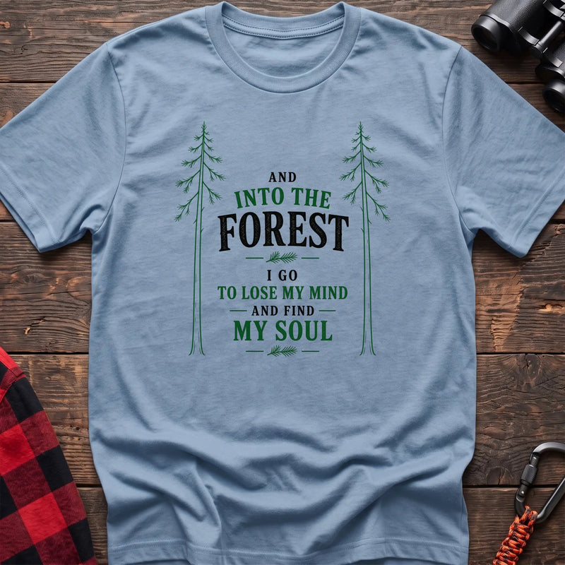 Light blue hiking t-shirt with pine trees and And Into the Forest I Go to Lose My Mind and Find My Soul quote
