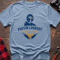 Light blue cotton t-shirt with a puffin and waterfall graphic and Puffin Lookout Waterfall Detour text on rustic wood