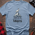 Light blue hiking t-shirt with a mountain goat on a peak and the text “Some of Us Were Born for 14ers”