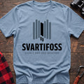 Light blue cotton t-shirt with a basalt column graphic and Svartifoss Basalt and Bad Weather text on rustic wood