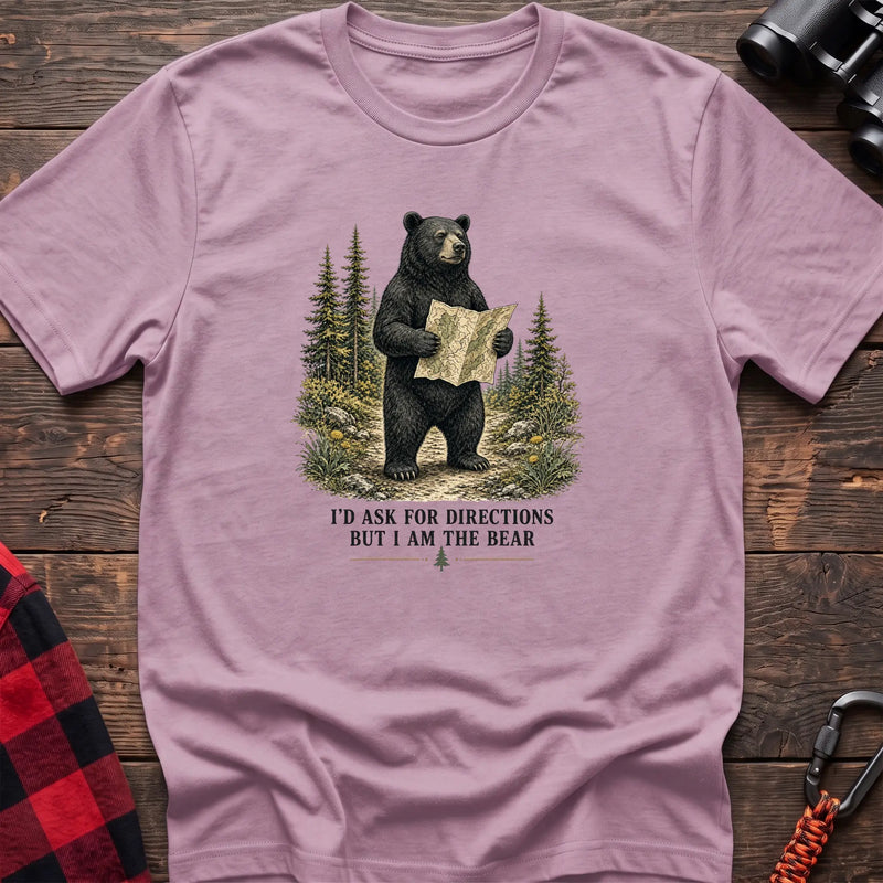 Light pink cotton t-shirt with a bear holding a map graphic and I’d Ask for Directions But I Am the Bear text on rustic wood