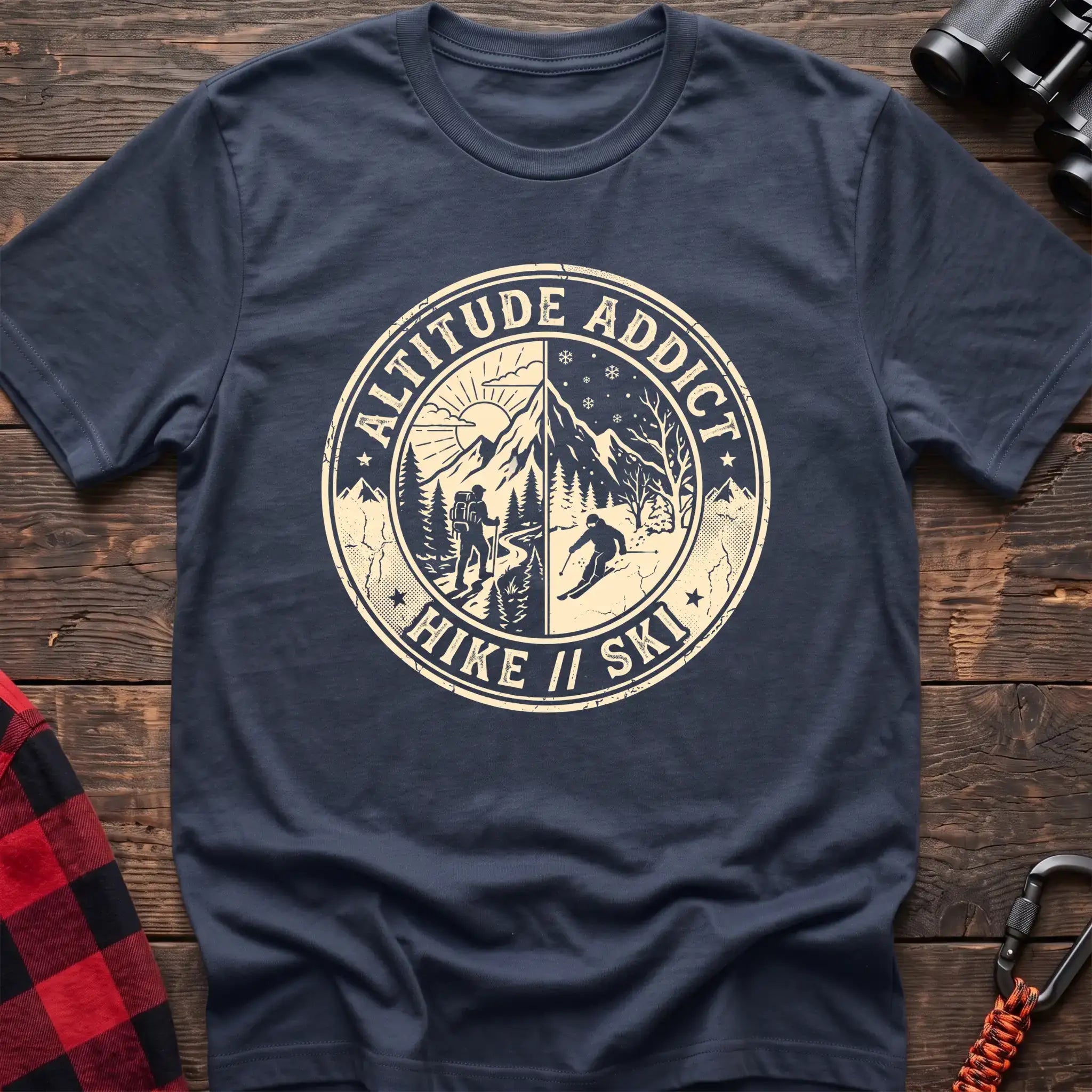 Navy t-shirt with circular badge graphic of a hiker and skier on split mountain scenes, reading Altitude Addict Hike Ski