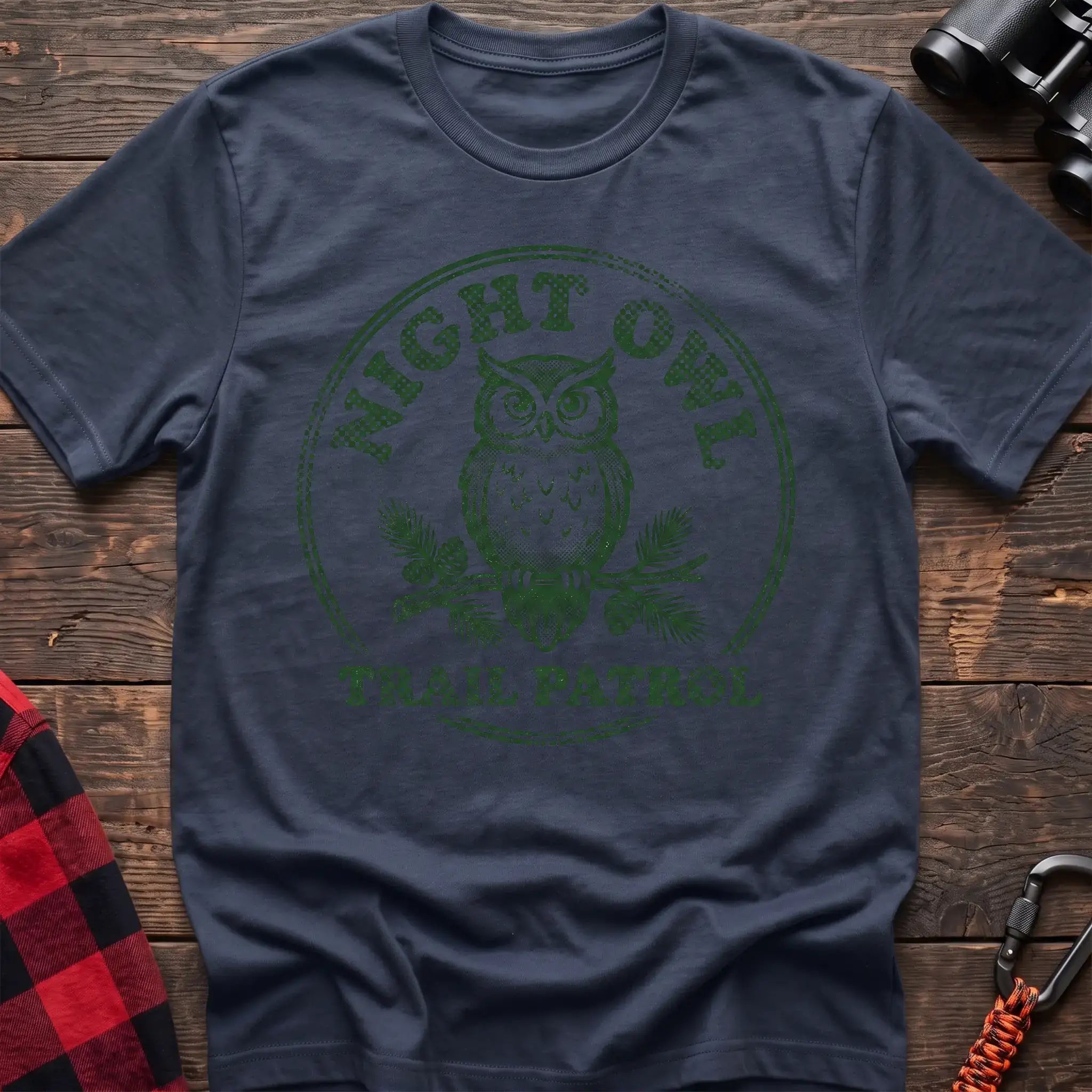 Navy t-shirt with green owl on a pine branch graphic and the text Night Owl Trail Patrol