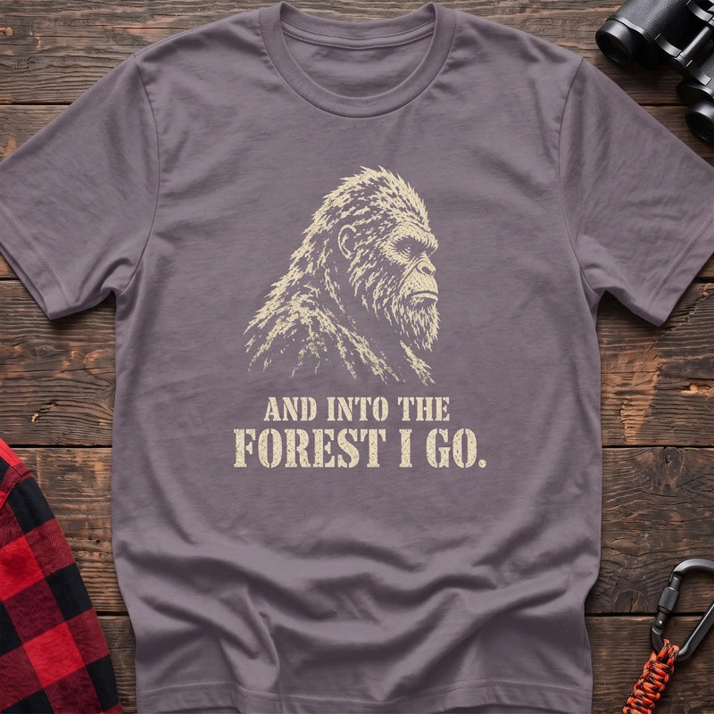 Paragon cotton t-shirt with a Bigfoot graphic and And Into the Forest I Go text on rustic wood