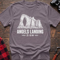 Paragon cotton t-shirt with a canyon graphic and Angels Landing Zion text on rustic wood