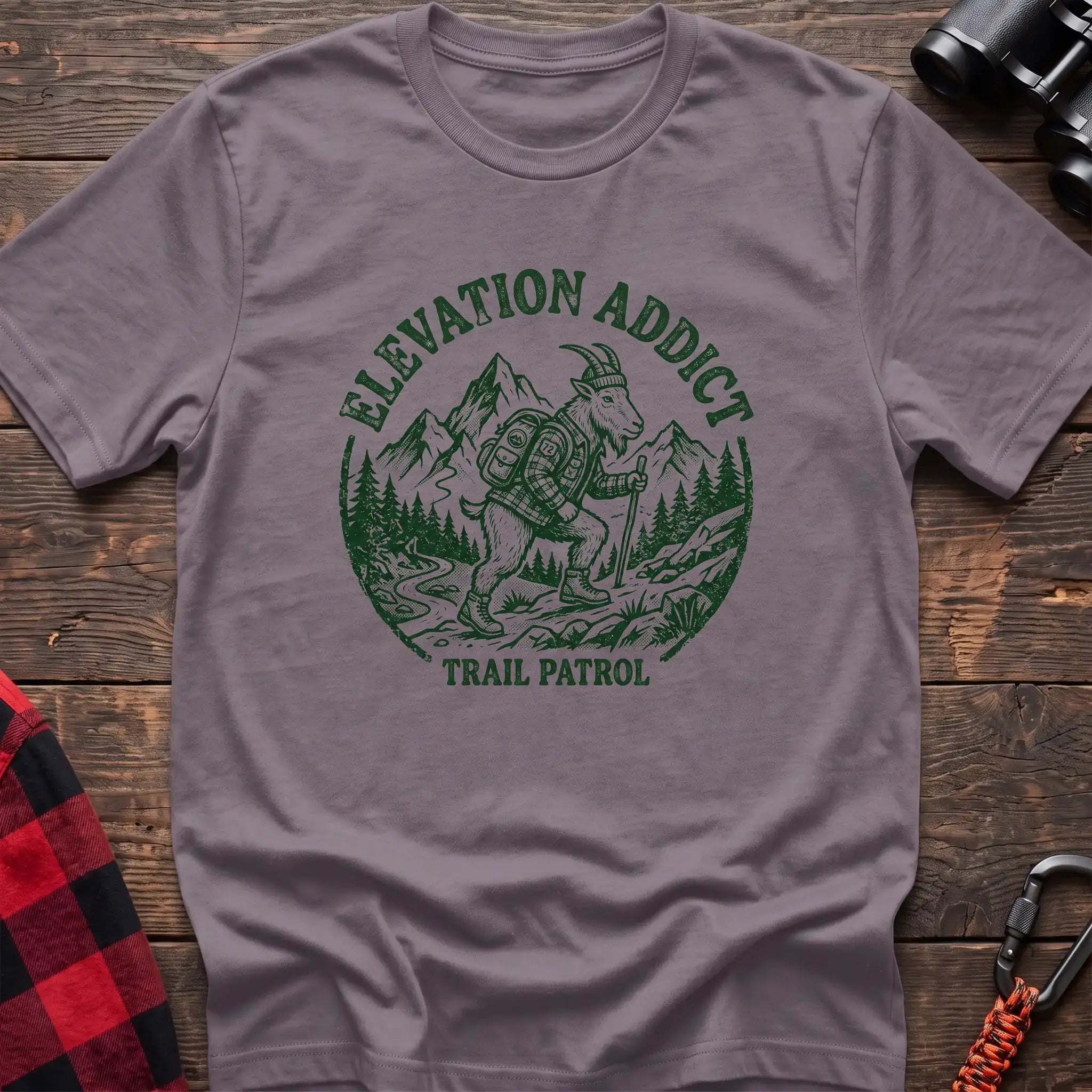 Paragon t-shirt with circular graphic of a hiking mountain goat and the text Elevation Addict Trail Patrol