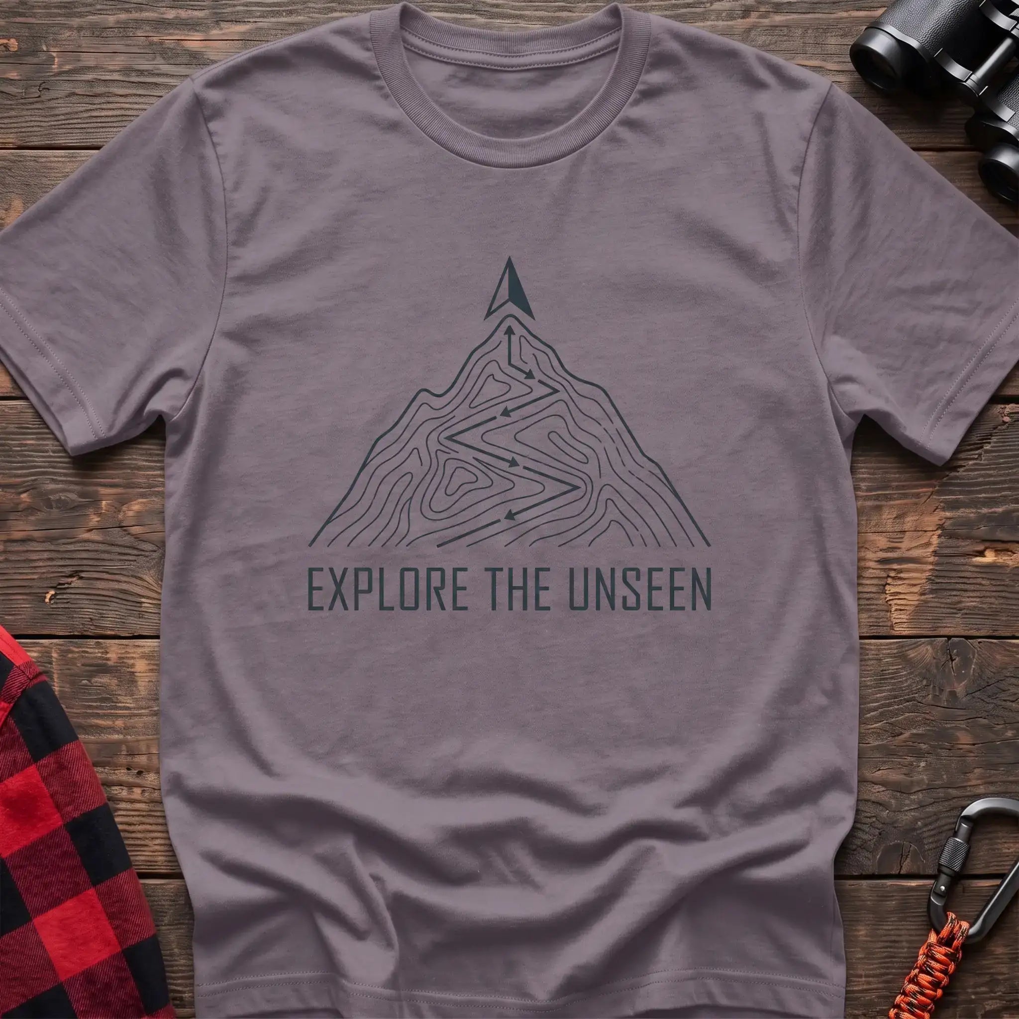Paragon t-shirt with topographic mountain trail graphic and the text Explore the Unseen
