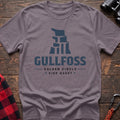 Paragon cotton t-shirt with a stylized waterfall graphic and Gullfoss Golden Circle Side Quest text on rustic wood