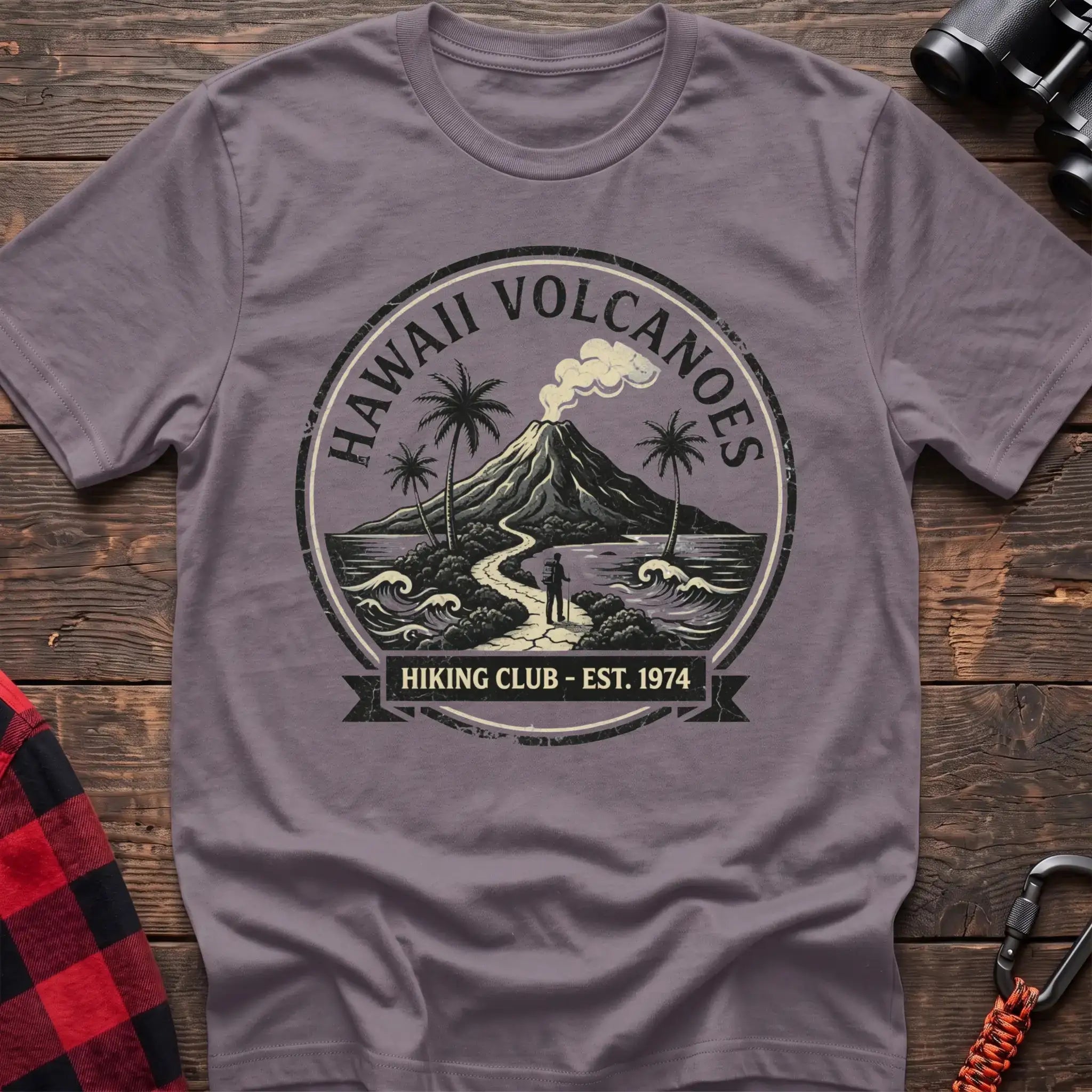 Paragon t-shirt with circular Hawaii Volcanoes badge graphic showing a volcano, palm trees, and a hiker, reading Hiking Club Est 1974