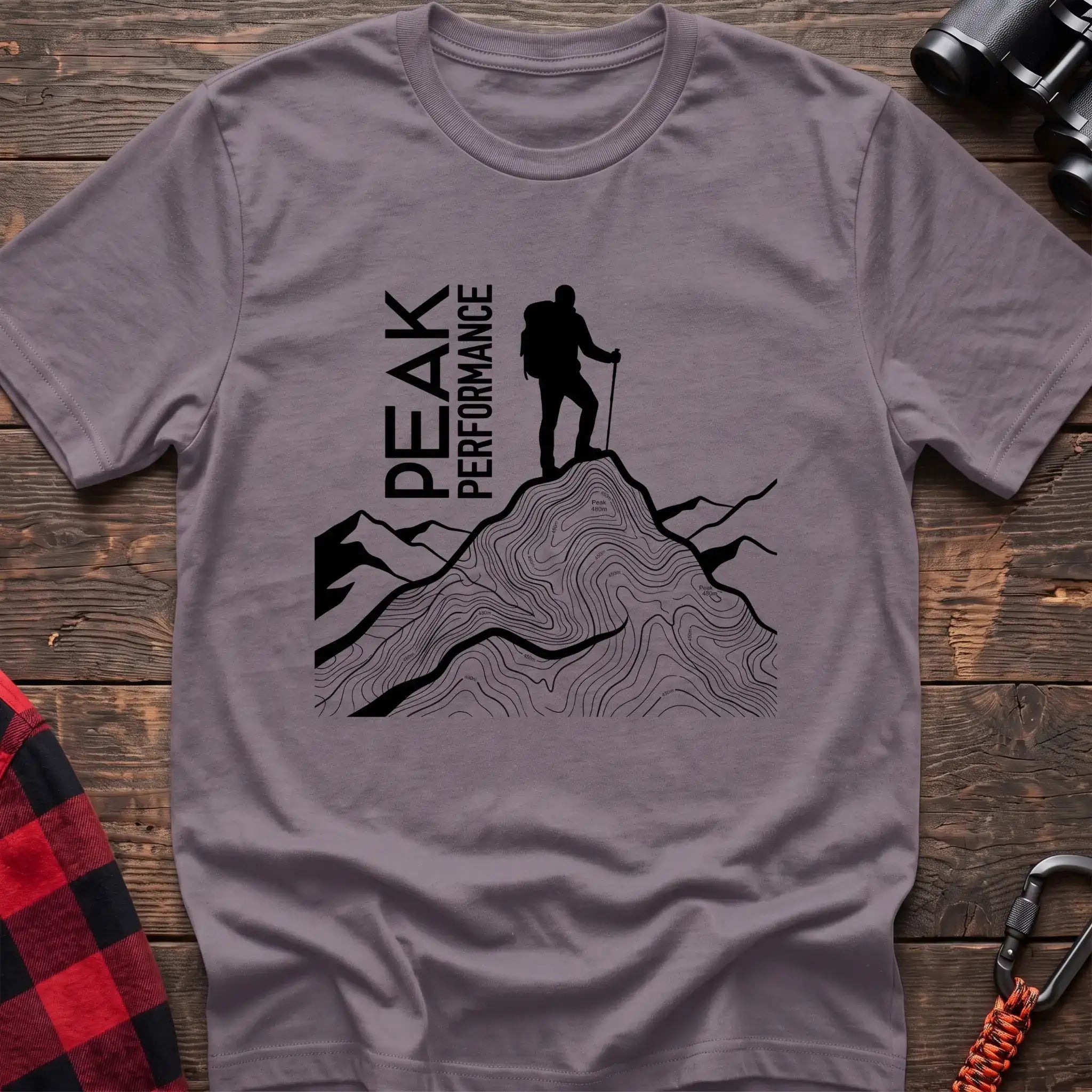 Paragon t-shirt with hiker silhouette on a topographic mountain peak and the text Peak Performance