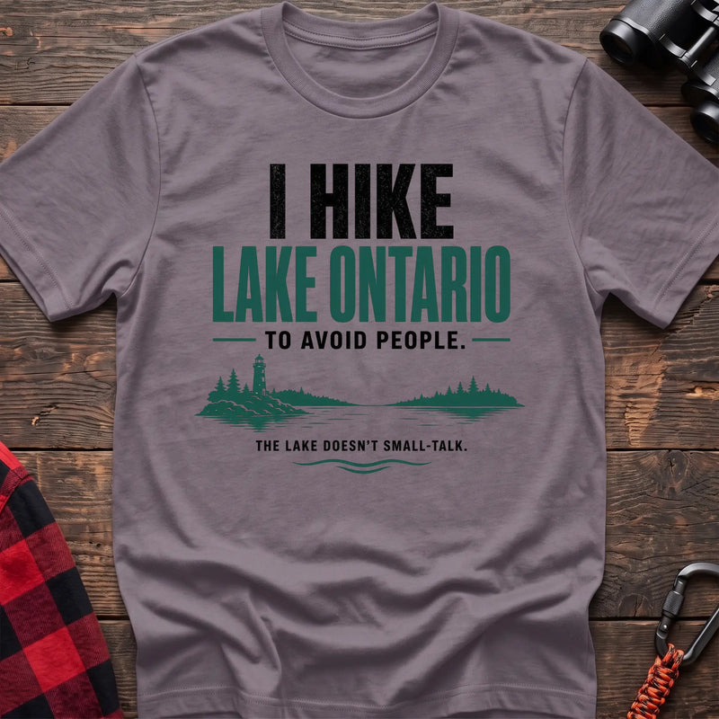 Paragon cotton hiking t-shirt with lighthouse and lake graphic and "I hike Lake Ontario to avoid people – the lake doesn't small-talk" quote