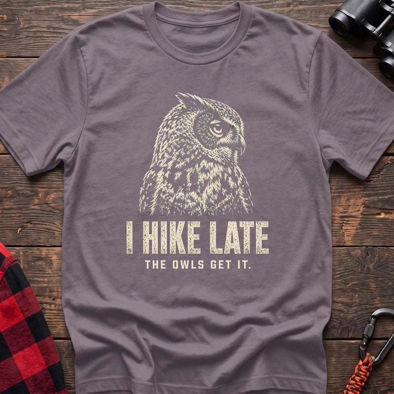 Paragon cotton t-shirt with an owl graphic and I Hike Late The Owls Get It text on rustic wood