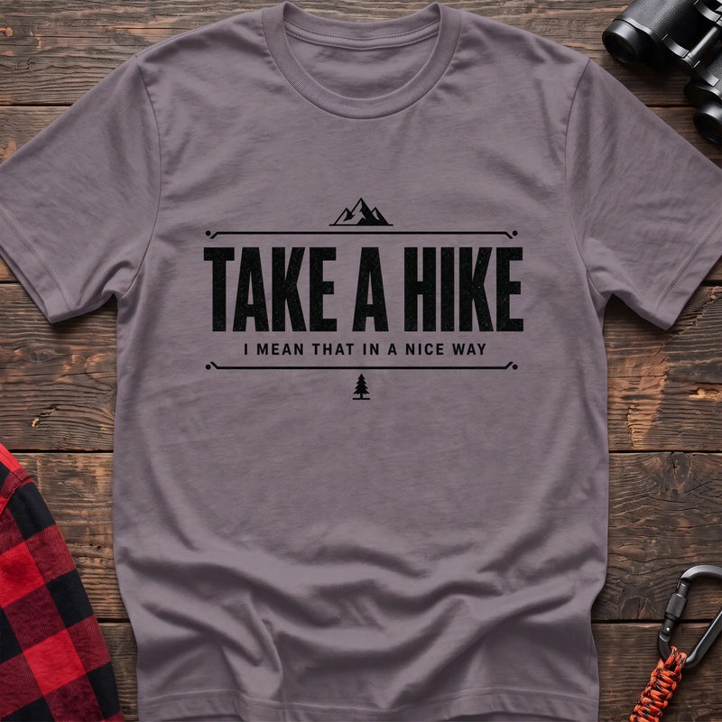 Paragon cotton hiking t-shirt with "Take a Hike I Mean That in a Nice Way" quote, mountain icon, and pine tree graphic