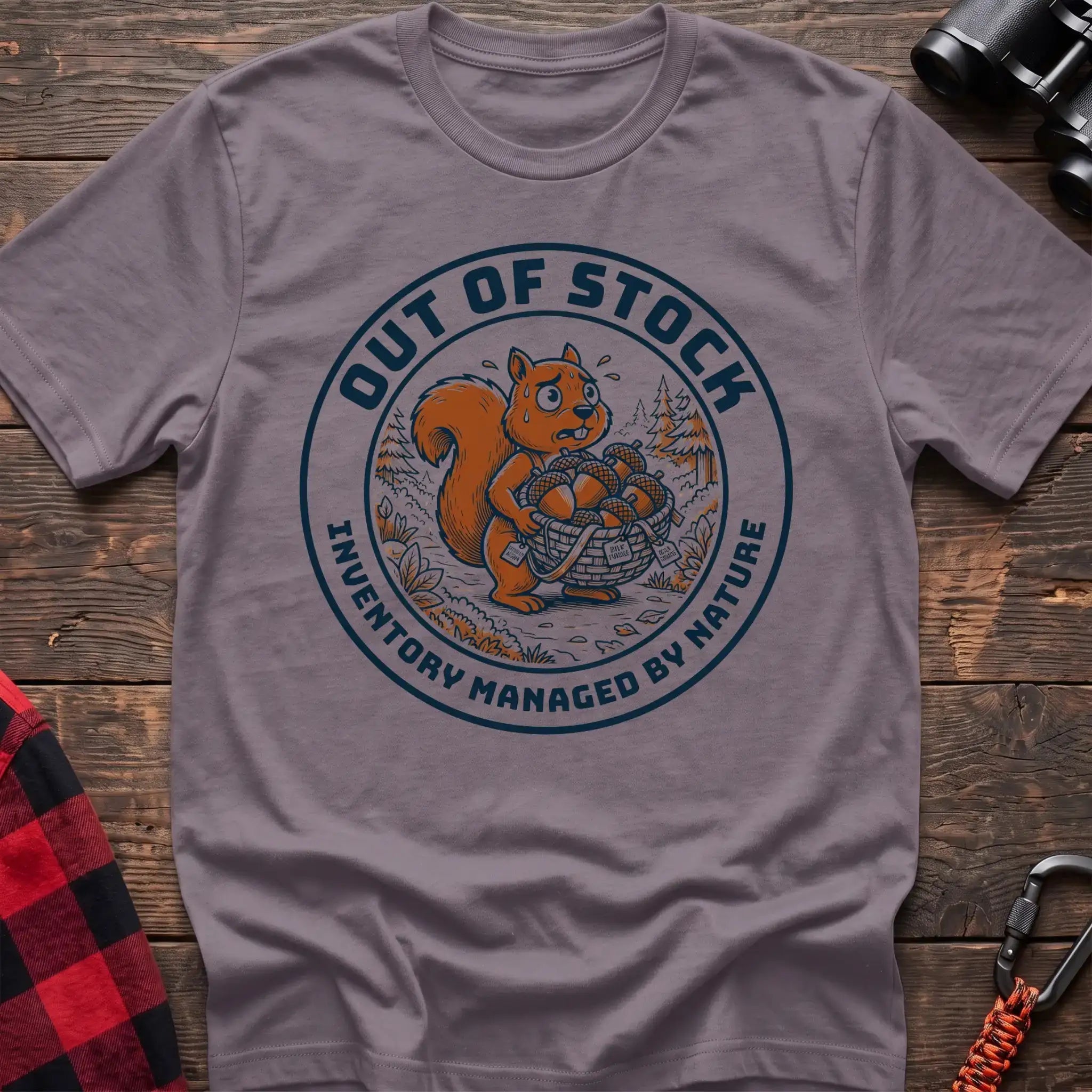 Paragon t-shirt with circular graphic of a stressed squirrel holding a basket of acorns, reading Out of Stock Inventory Managed by Nature