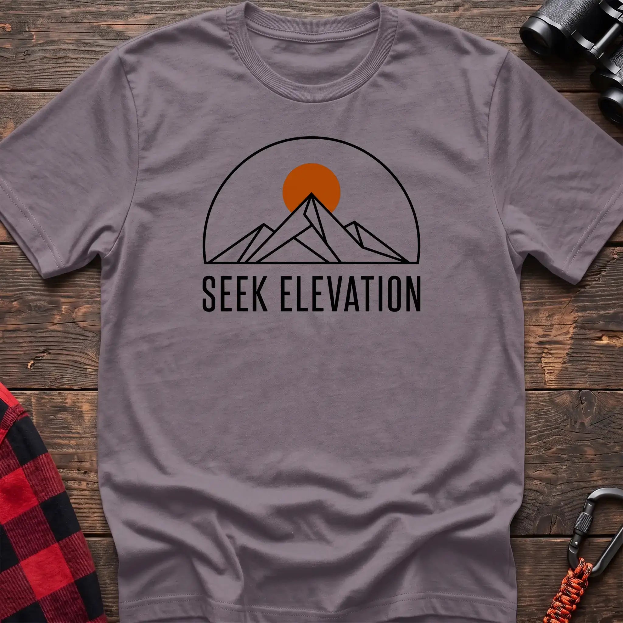 Paragon t-shirt with minimalist mountain and sun graphic reading Seek Elevation