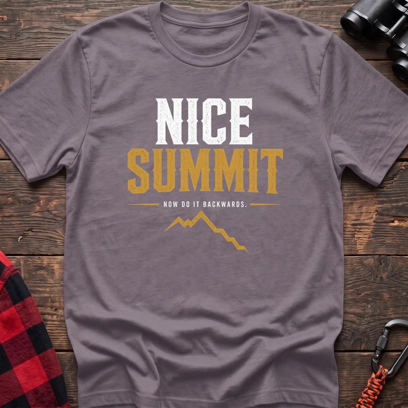 Paragon cotton t-shirt with a mountain graphic and Nice Summit Now Do It Backwards text on rustic wood