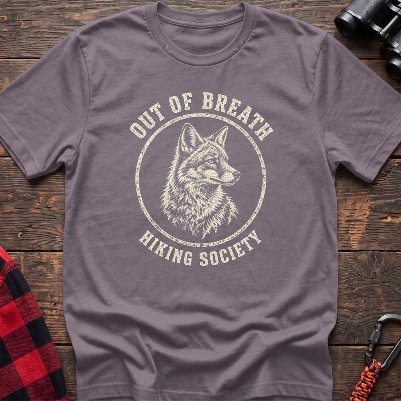 Paragon cotton t-shirt with a wolf graphic and Out of Breath Hiking Society text on rustic wood
